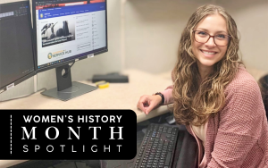 Analyst with the parole division sitting at a computer in an office.