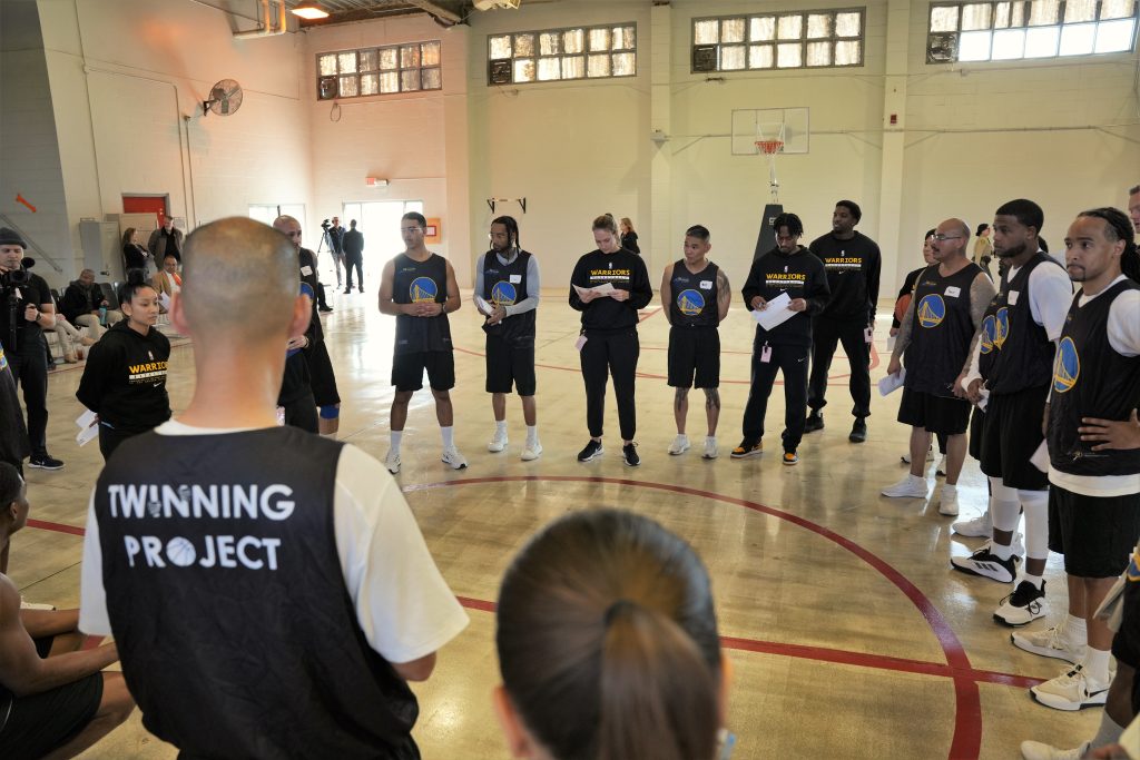 CSP-Solano Twinning Project with players and volunteers in a gymnasium. 