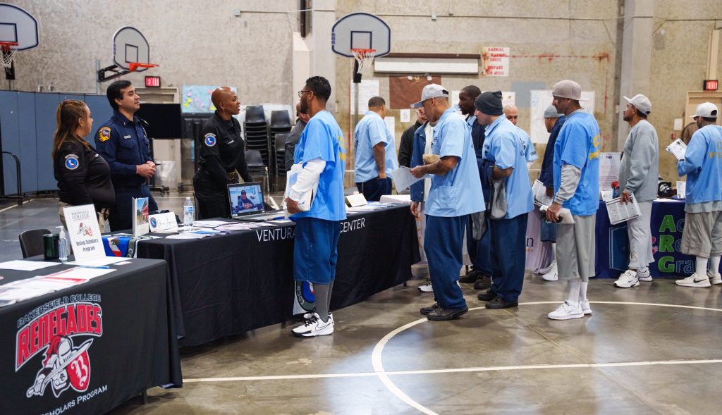 Incarcerated at resource tables interacting with staff NKSP