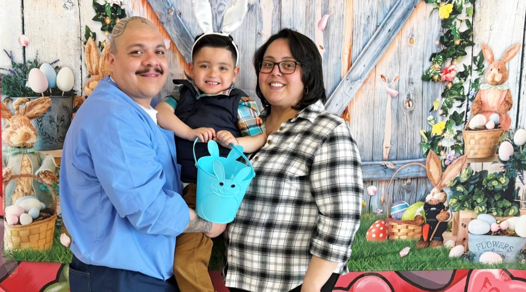 A family posing for photos at CCI visiting for Easter.