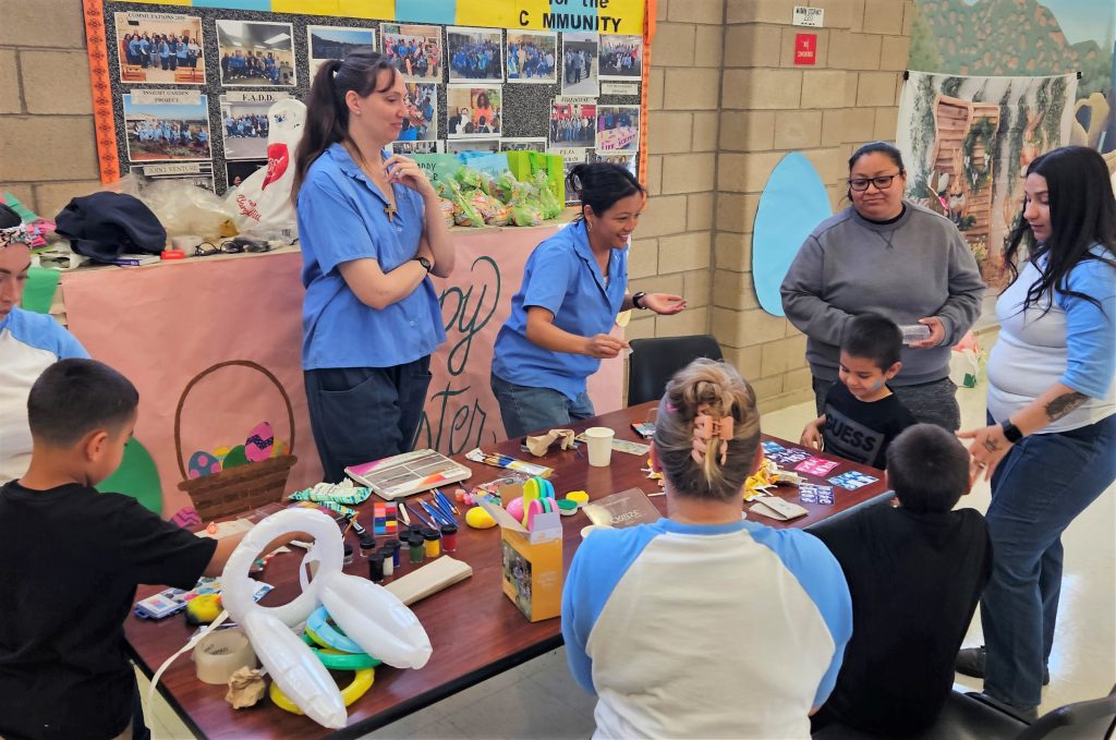 Incarcerated women help visiting children with crafts at CCWF.