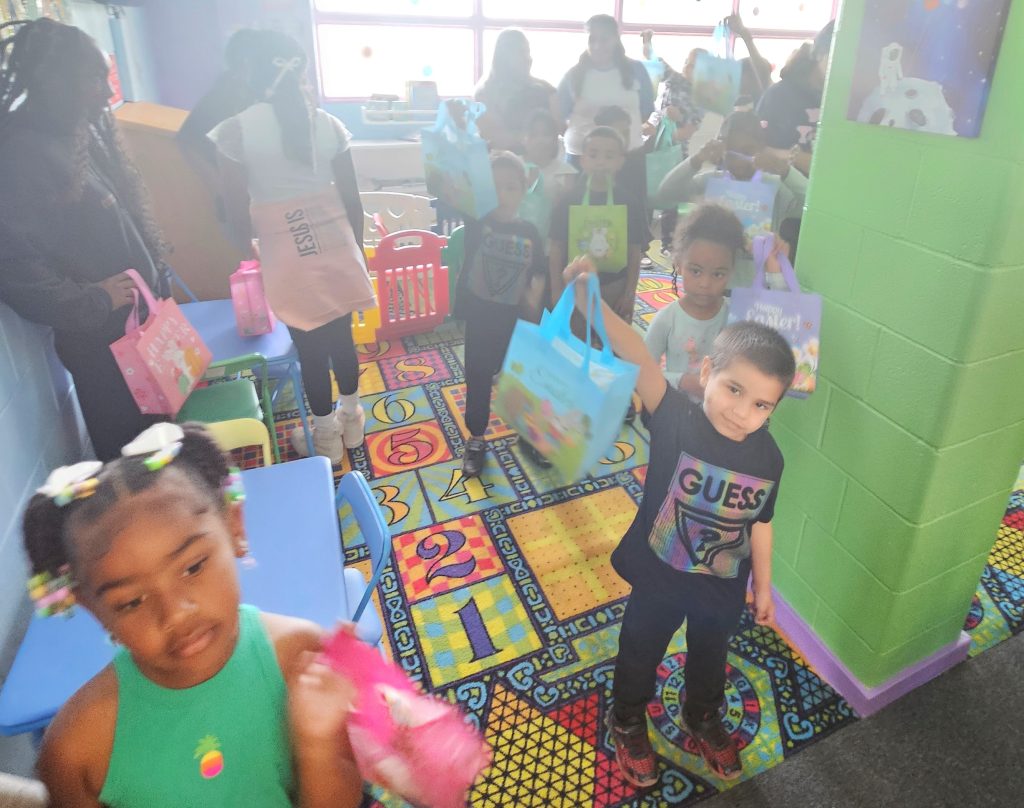 Children line up to go on an egg hunt at CCWF.