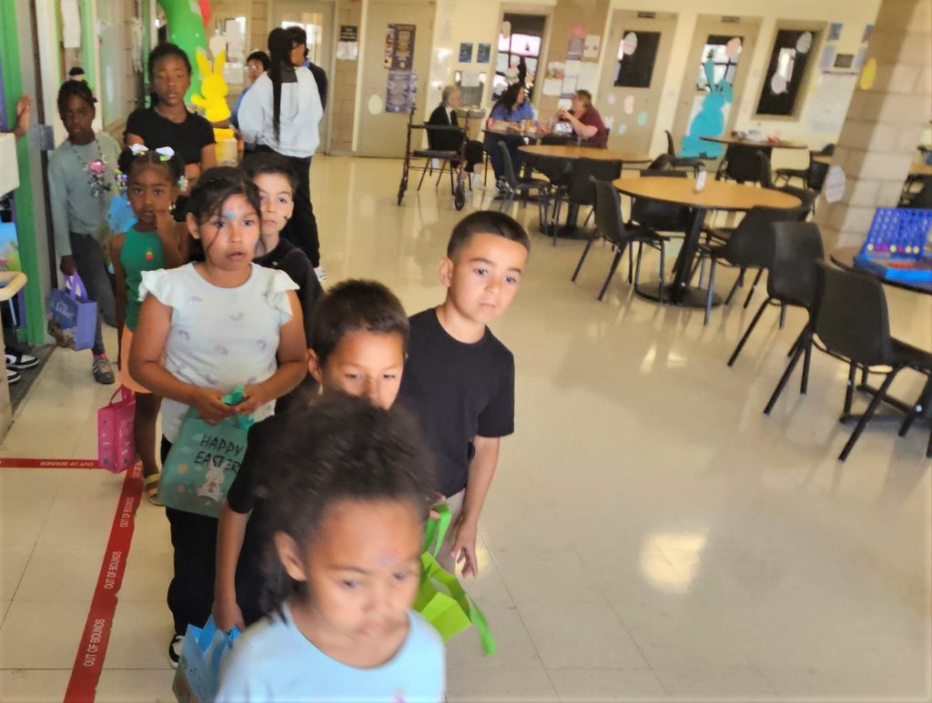 Children line up for an egg hunt at CCWF.