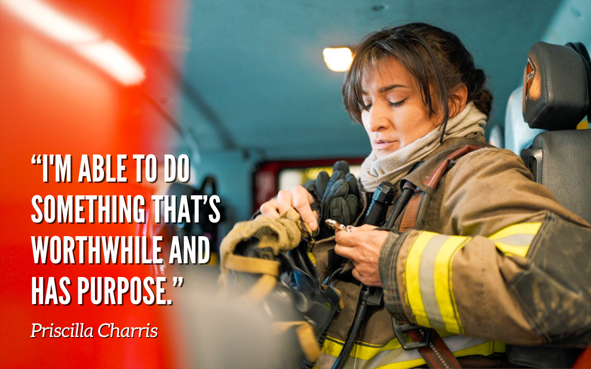 Female firefighter buckling into her seat in a fire engine at CCWF.