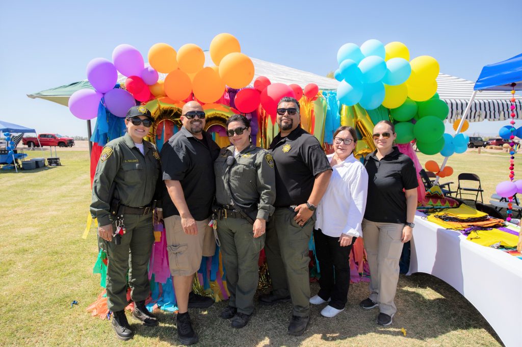 Staff at the Chicano Correctional Workers Association booth.