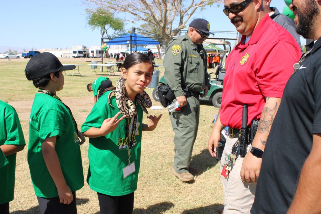 The kids also learned about local wildlife from Plant Operations and Vector Control at Centinela. A child is shown with a snake draped over her shoulders.