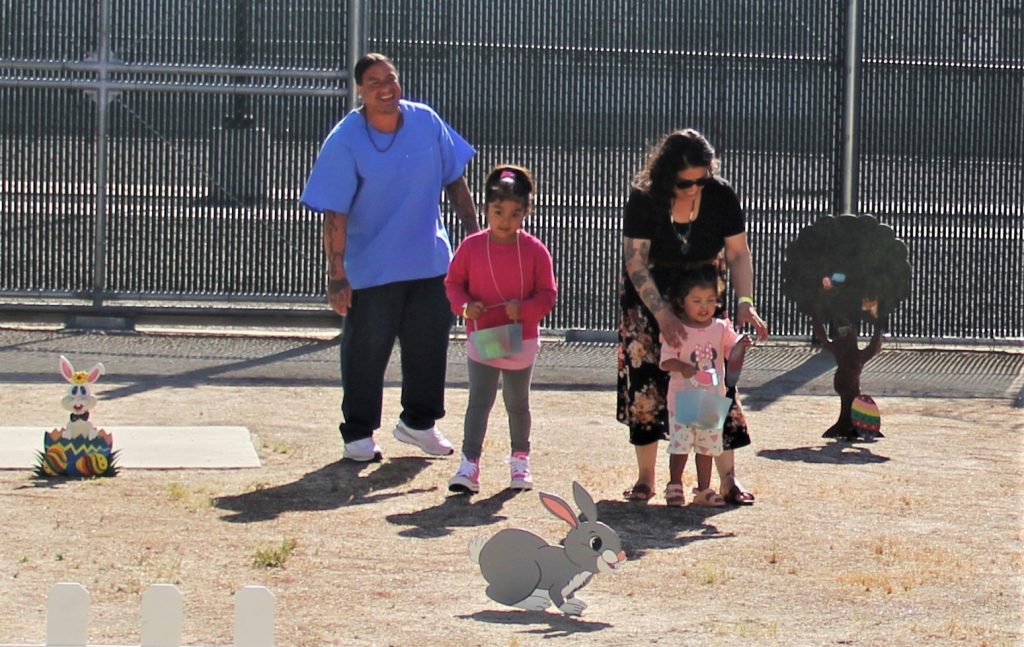 Children hunt eggs during visiting at CDCR, California Health Care Facility (CHCF) in Stockton, Calif.