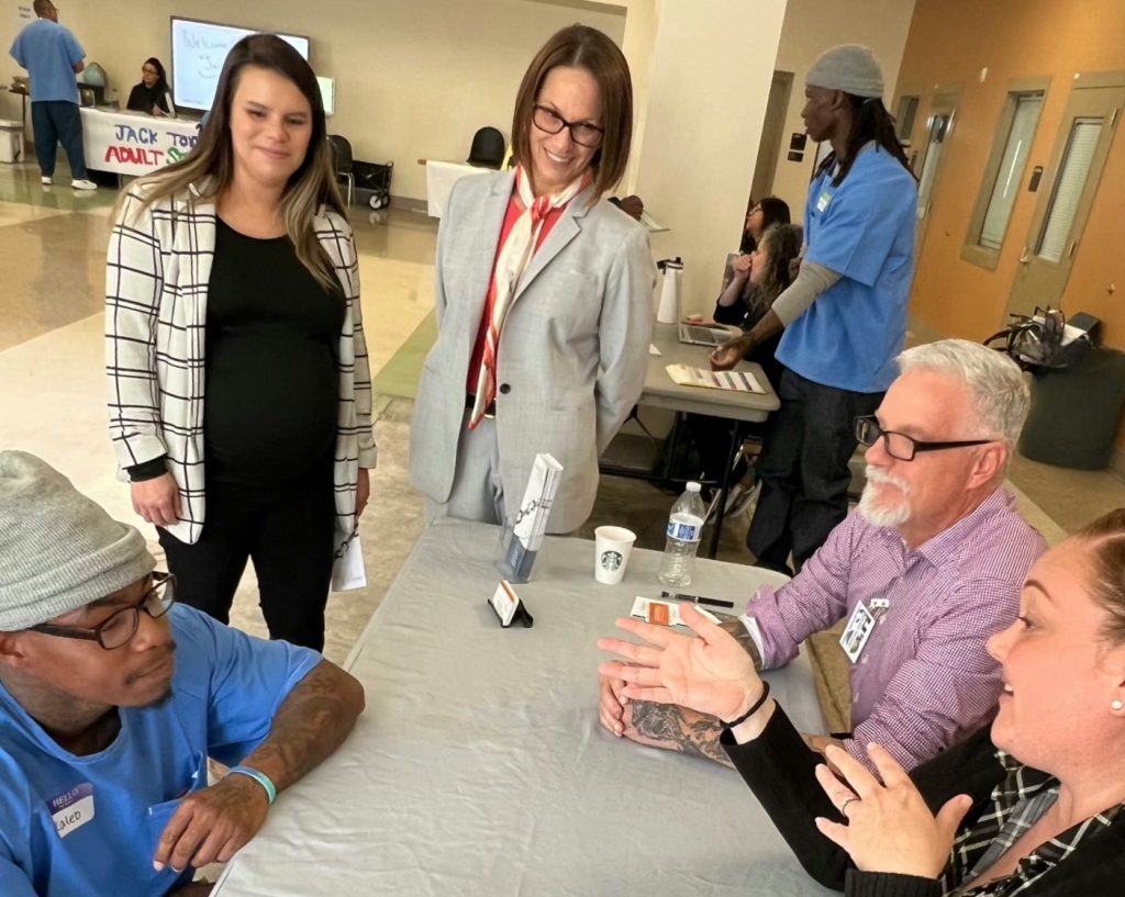 CHCF reentry fair with Director Gena Jones and others at a booth.