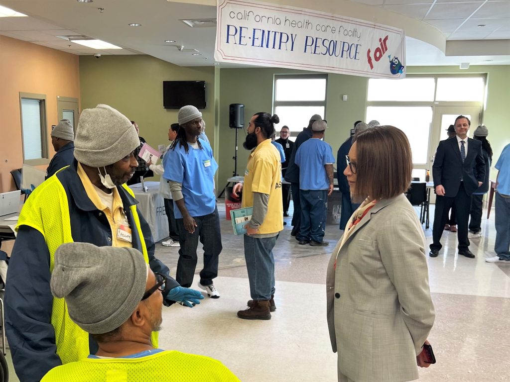 CHCF reentry resource fair with people in a lobby.