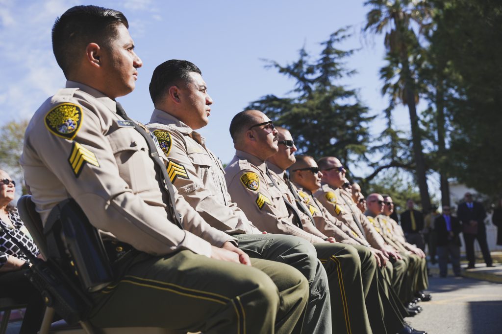 New sergeants sitting at a promotional ceremony at CIM.