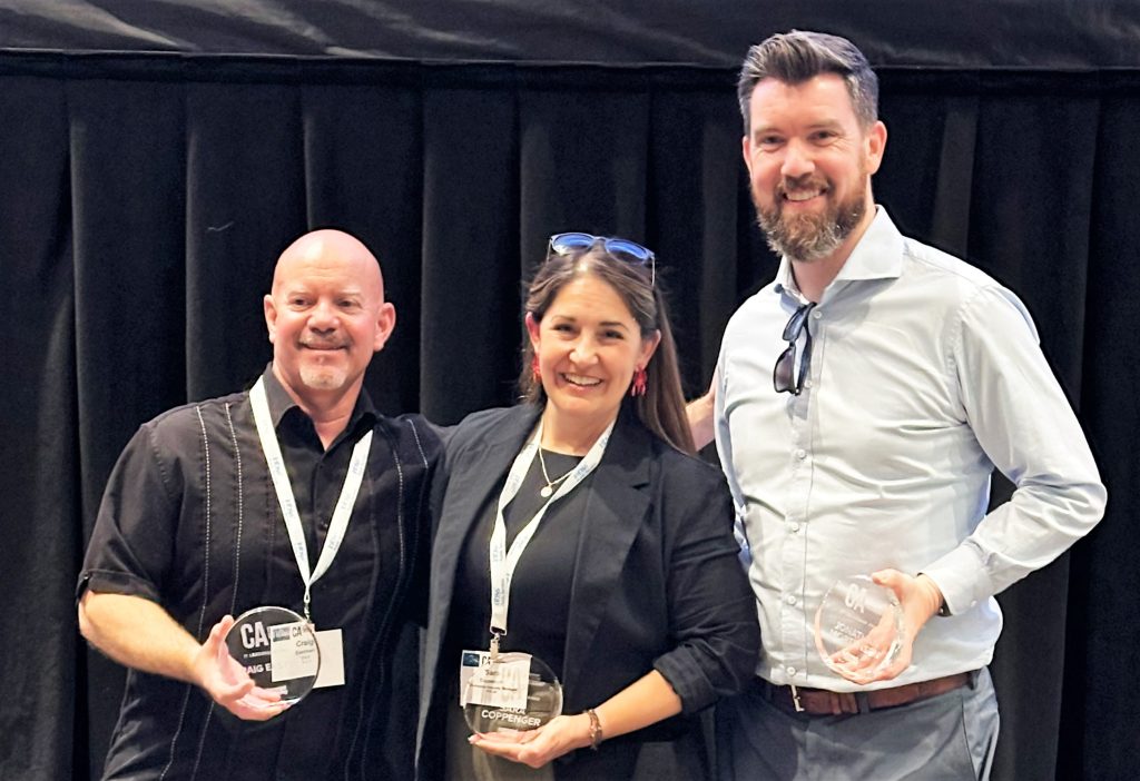 Three people with CIO Academy awards.