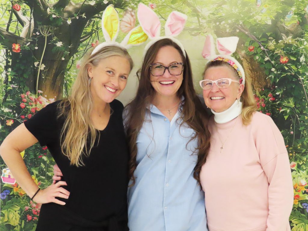 Easter visiting with three people wearing bunny ears at California Institution for Women.