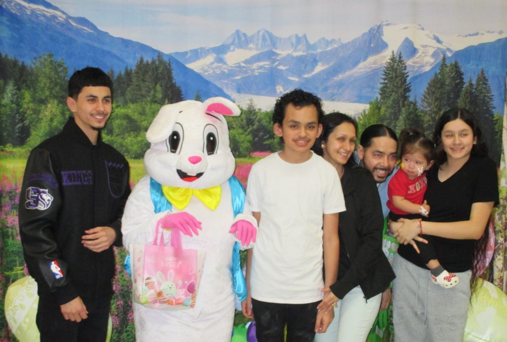 Easter bunny with a visiting family at CMF.