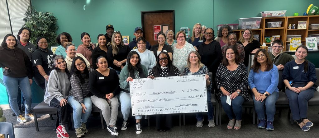 CMF Warden (A) Sircoya Williams with charitable donation check to Solano Family & Children's Services in Fairfield