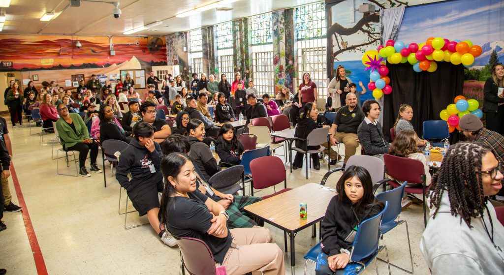 Gathering in the visiting room at CMF in Vacaville. 