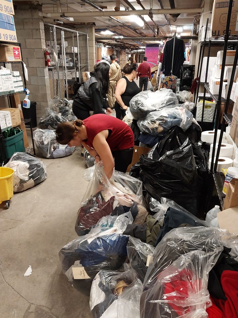 FOX and DAPO Sorting clothes donation