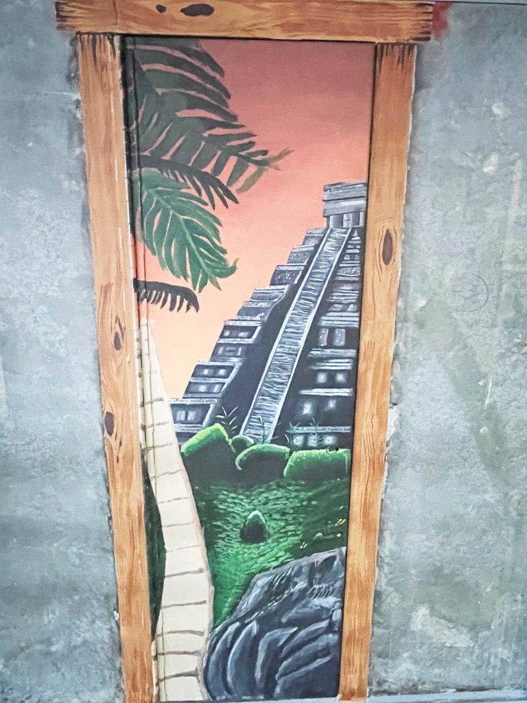 A Mayan-style pyramid in the jungle is painted inside prison housing unit in Susanville, California.