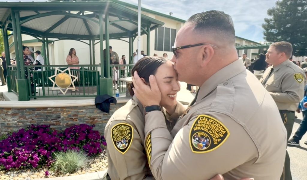 Officer Joseph Celis with daughter Officer Vanessa Celis at graduation
