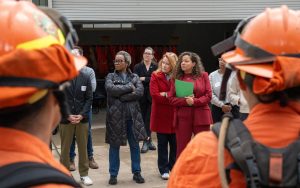 Legislators with incarcerated wildfire hand crew members at Pine Grove Youth Conservation Camp.
