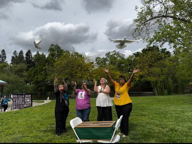 National day of remembrance for murder victims event, 4 victims releasing doves