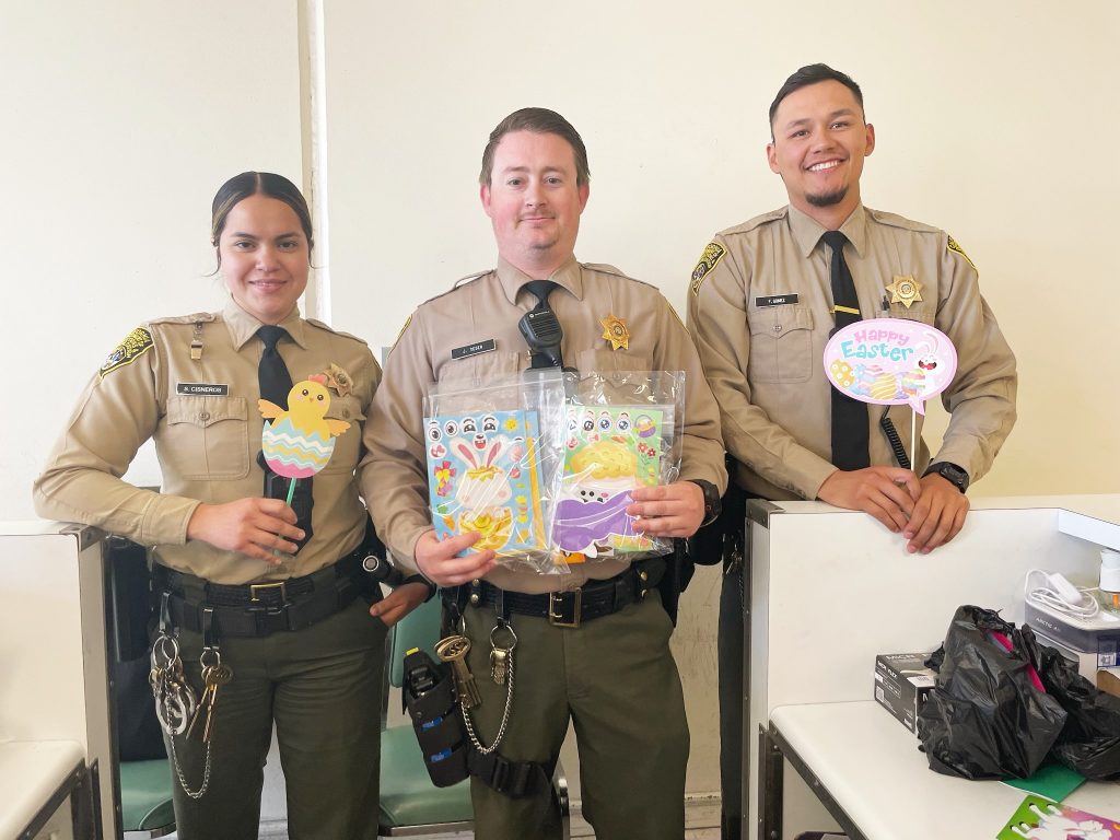 SATF staff with Easter-themed crafts for the kids.