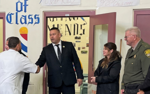 Staff attend a recognition ceremony for volunteer barbers at a California prison.