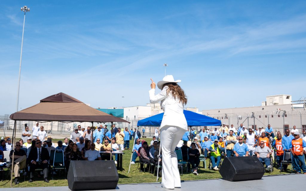 A music festival at SATF with a crowd in the background.