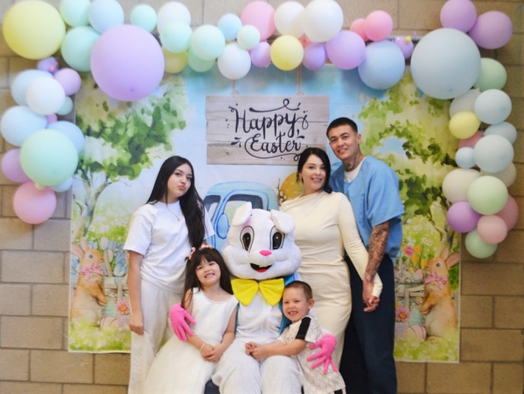 Posing for photos with the Easter bunny at Valley State Prison enjoys time together for visiting on Easter Sunday.