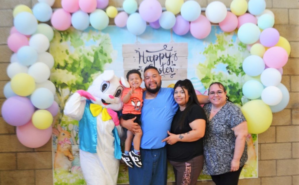 Posing for photos with the Easter bunny at Valley State Prison enjoys time together for visiting on Easter Sunday.