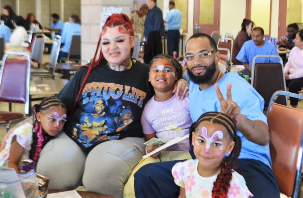 A family at Valley State Prison enjoys time together for visiting on Easter Sunday.