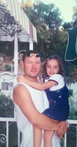 Young Officer Joseph Celis holding daughter Vanessa