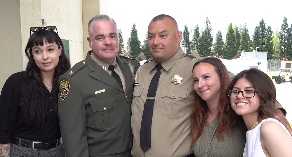 Tory Brandsen with his father, wife, and two daughters.