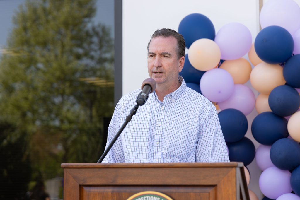 Secretary Macomber speaks.