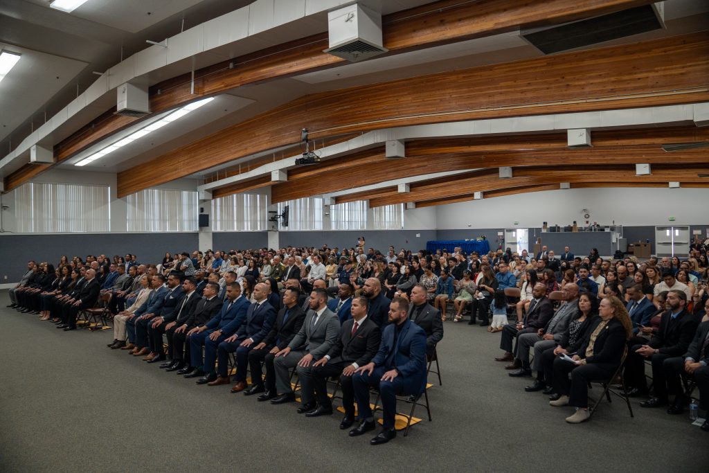 Family members and new parole agents at the academy graduation held May 1, 2025, in Galt, California.