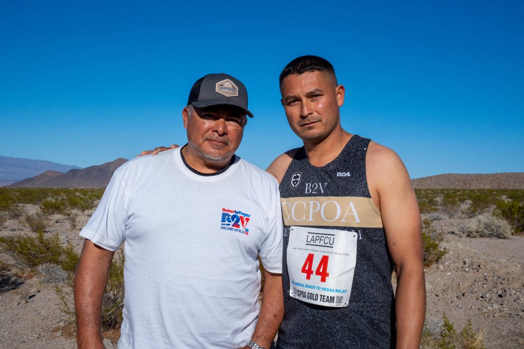 Officer Giovani Perezchica and his coach at Baker to Vegas race.