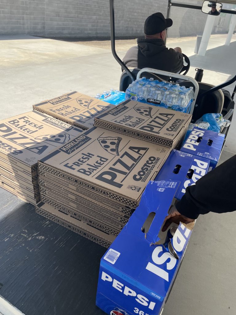 Delivering pizza and drinks to staff at CHCF in Stockton.