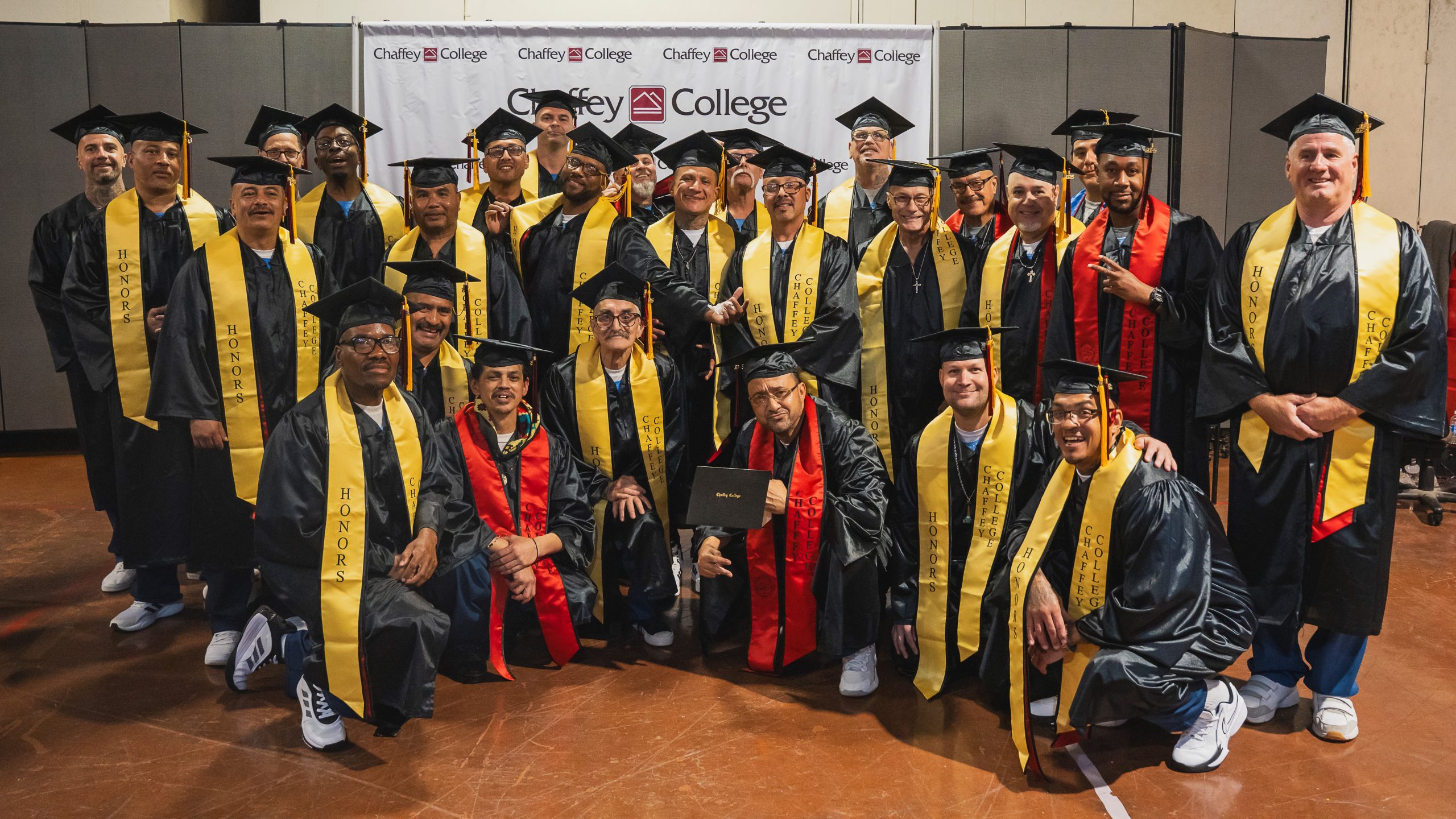 Chaffey College graduates in a group at California Institution for Men (CIM) in Chino.