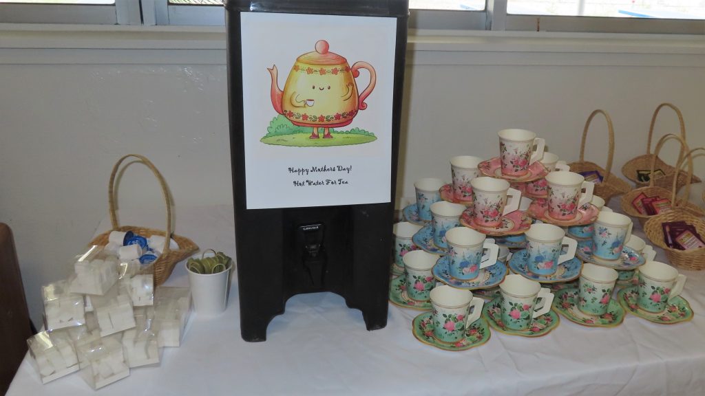 Fancy paper teacups and saucers for afternoon tea with their incarcerated loved ones at California Institution for Women during Mother's Day visiting in May 2025 at Corona, California.