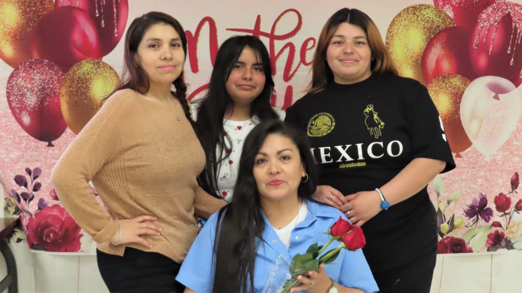 Three young women visit their incarcerated mother at California Institution for Women during Mother's Day visiting in May 2025 at Corona, California.