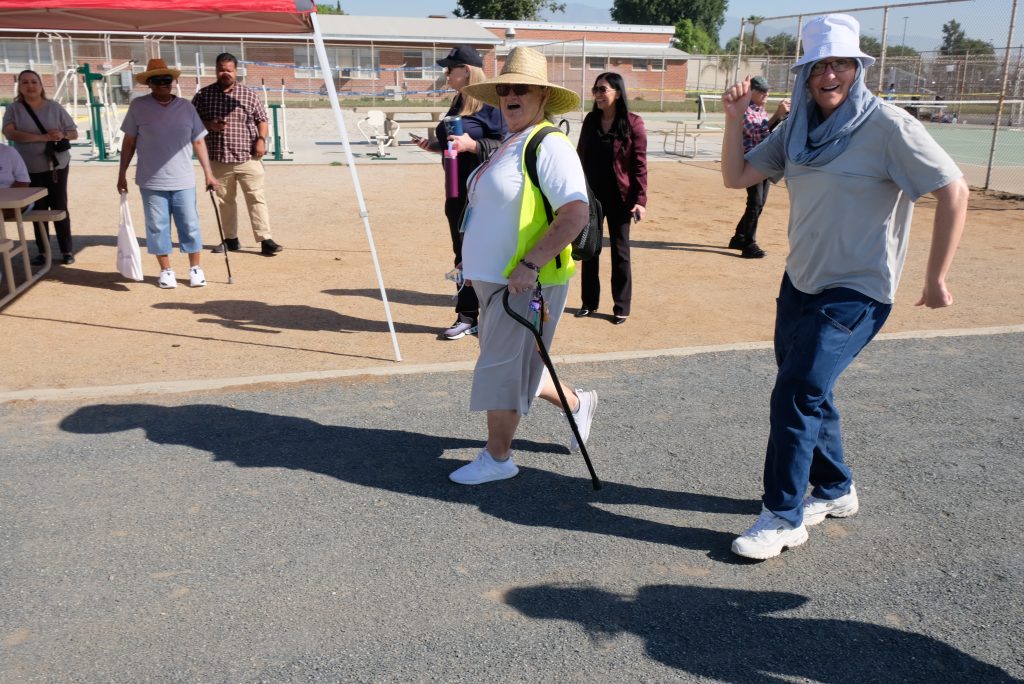 Two people using canes but still taking part in the CIW 5k Run to Rebuild. 