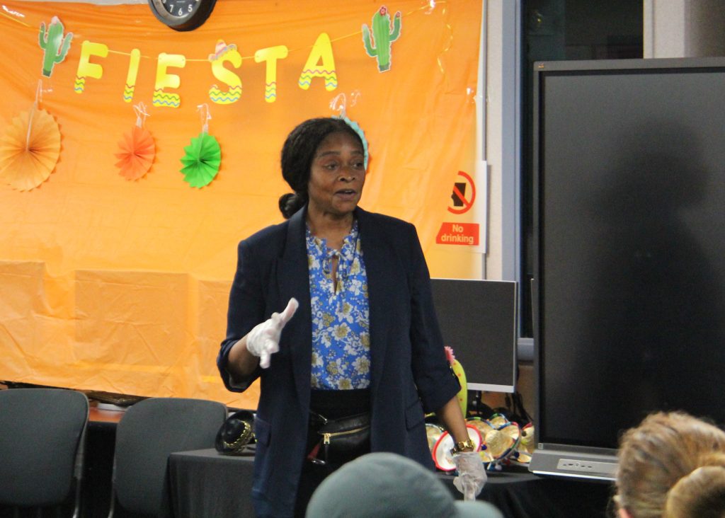 Staff appreciation at El Prado Adult School at CIW with one person speaking to the lunch gathering.