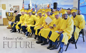 Visions Adult School saw 80 students graduate with various degrees, diplomas and certificates at California State Prison, Corcoran. The image shows a group of people wearing yellow caps and gowns with the words "Visions of the Future" at the bottom.