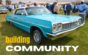 CTF car show with the words "building community" overlaying the image of a car on a California prison yard with incarcerated people wandering around checking out the classic vehicles.