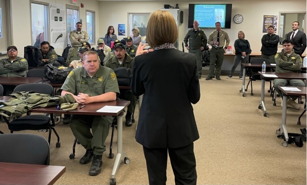 Gena Jones, director of DAI, speaks with CCI staff in the in-service training room.