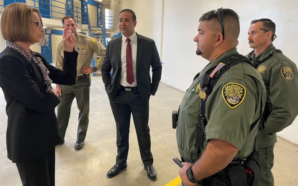 DAI Director Gena Jones speaks with correctional officers at CCI-Tehachapi.