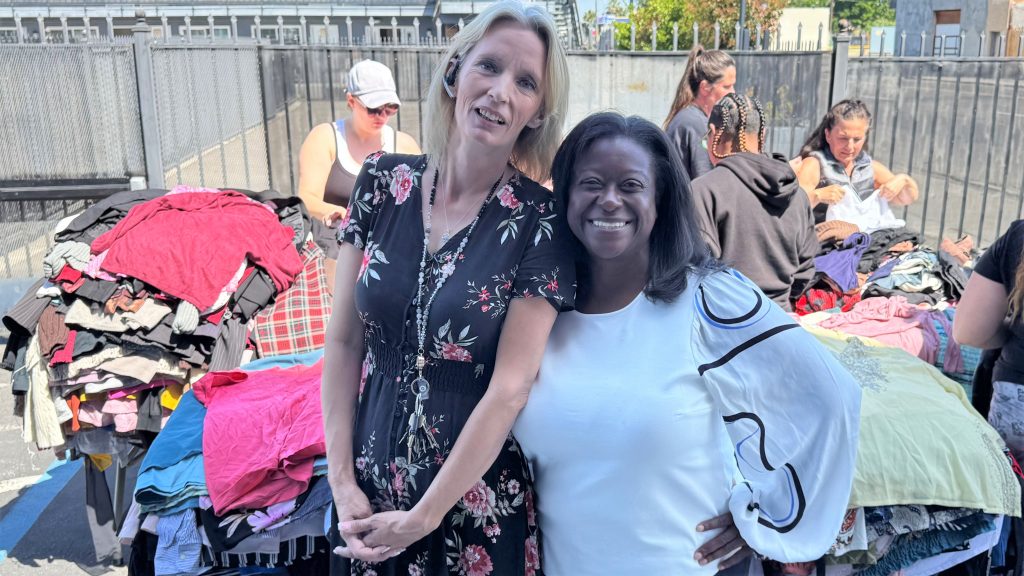Two staff at the clothing donation for FCRP-Stockton.