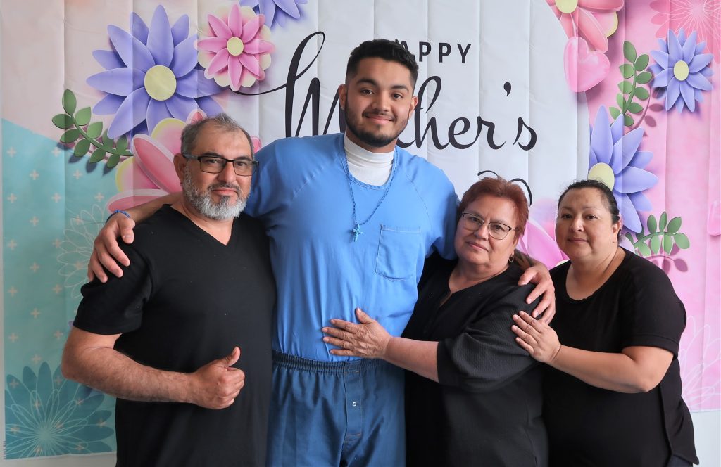 A family visits their incarcerated loved one during Mother's Day visiting at High Desert State Prison, Susanville, California.