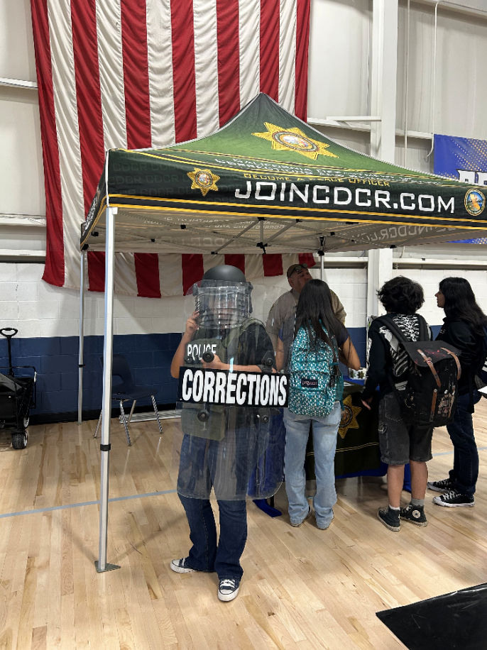 Student wearing riot gear at career day