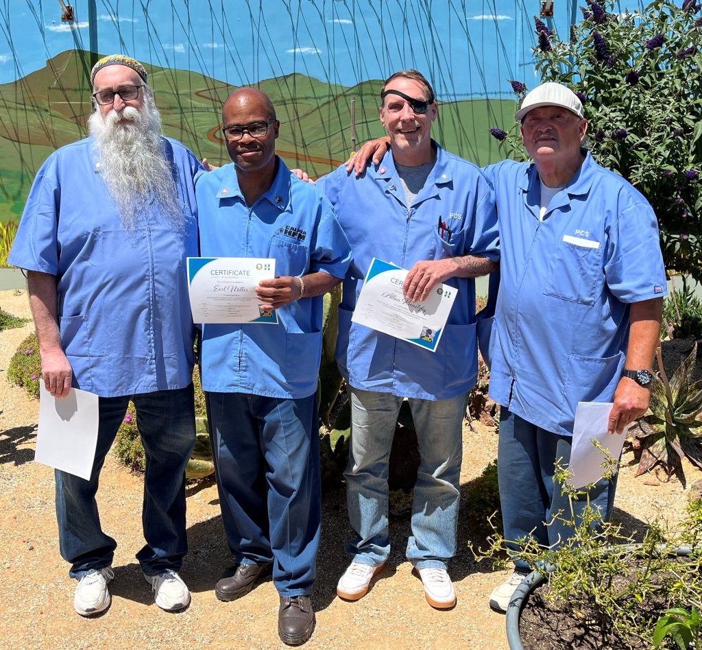 IP's smiling with certificate awards