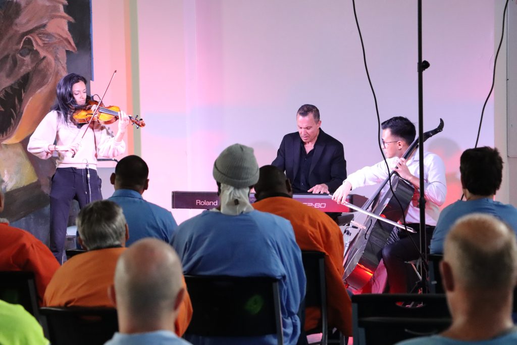 Eric Genuis playing piano